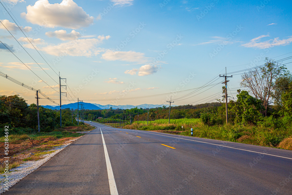 Fototapeta premium Rural road with beautiful mountains in Thailand,sky road over top of mountains with green jungle in Nan province, Thailand
