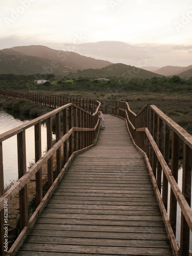 wooden bridge over the lake in Sardinian hills 