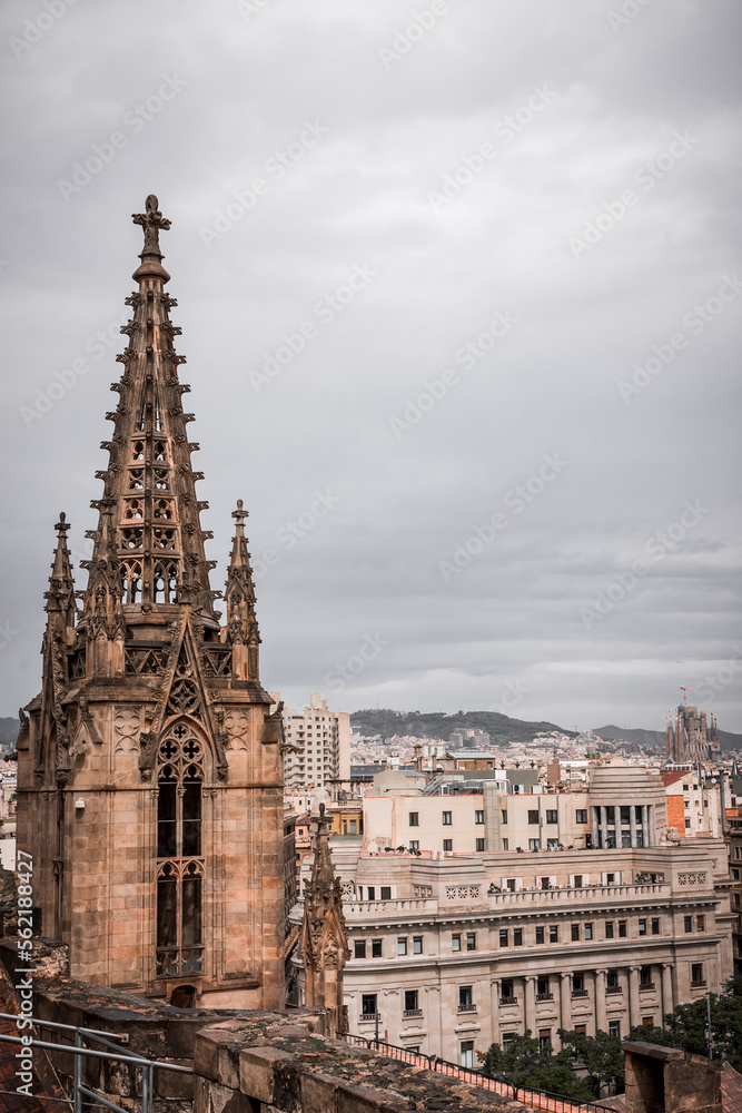 The spire of the cathedral of barcelona photographed from the rooftop which offers a breathtaking view