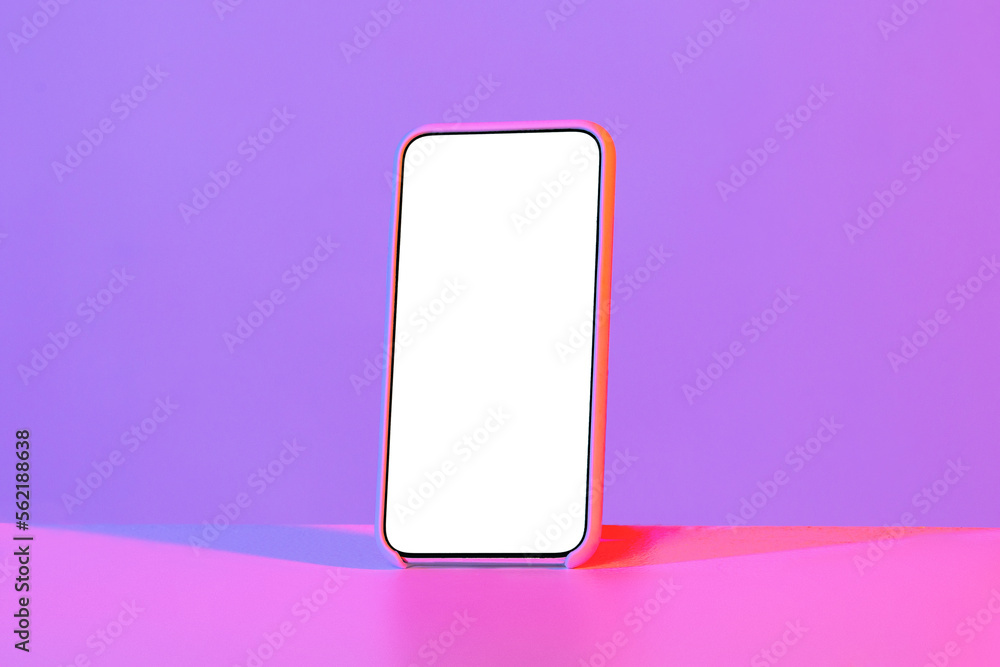 Smartphone with white blank screen, isolated on neon background Smartphone with white blank screen, isolated on neon background
