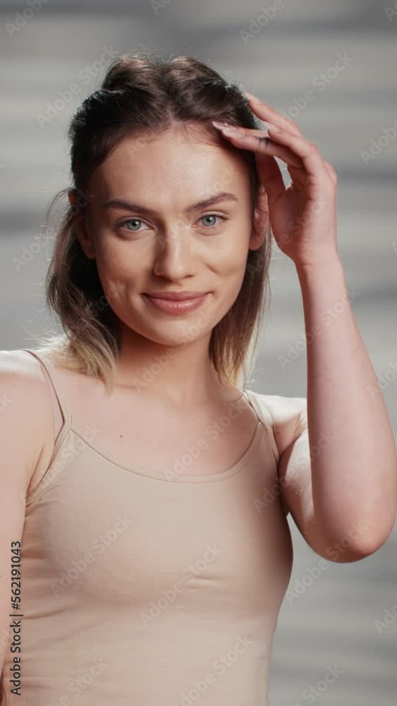 Vertical video: Flawless beauty model doing empowering campaign for self love and body positivity, using skincare cosmetics. Young beautiful adult feeling positive and confident, advertising Vertical video: Flawless beauty model doing empowering campaign for self love and body positivity, using skincare cosmetics. Young beautiful adult feeling positive and confident, advertising