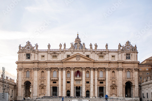 Saint Peter's Basilica in Rome from the ellipse of the square in cloudy day © angel