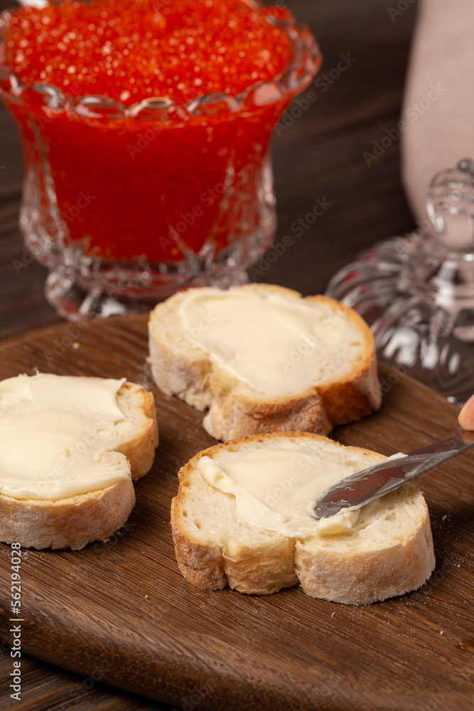 Baguette sandwiches with butter and red caviar Baguette sandwiches with butter and red caviar