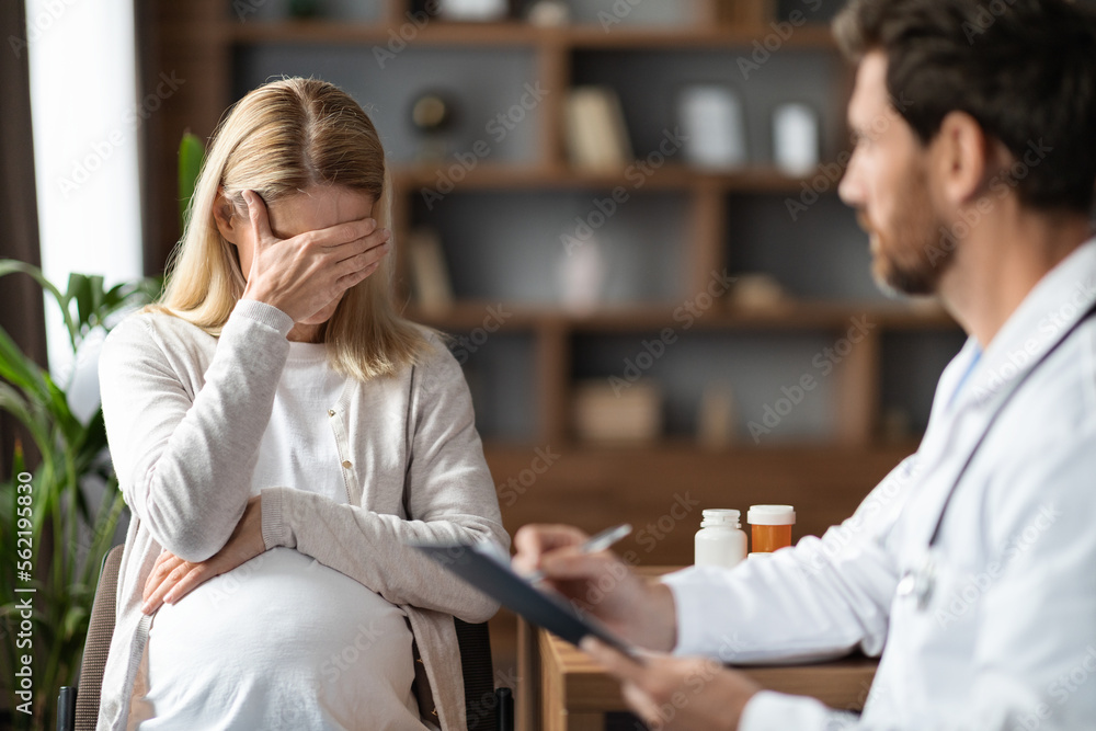 Portrait Of Crying Pregnant Woman During Meeting With Gynecologist Doctor Portrait Of Crying Pregnant Woman During Meeting With Gynecologist Doctor