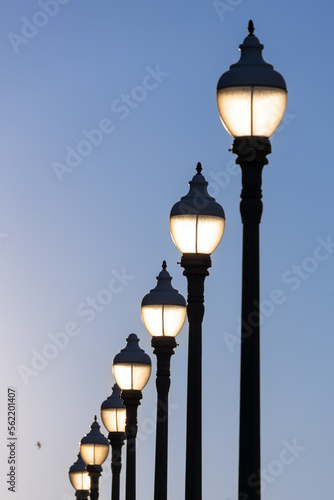 Row of old street lamps in the evening.