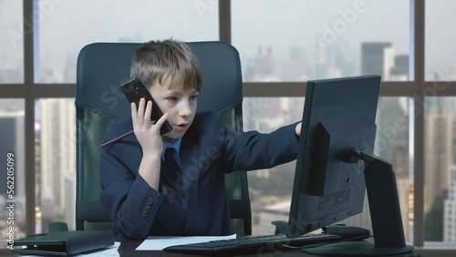 Young businessman with suit and tie talk at phone and write, office window view © MEDIAIMAG