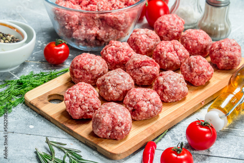 Raw beef meatballs with herbs and spices.