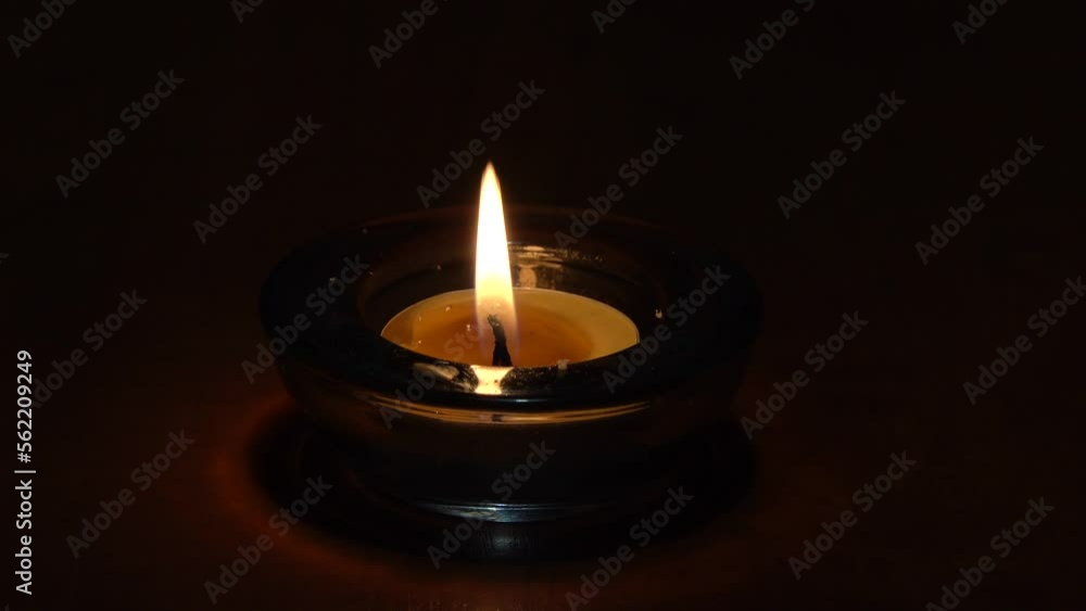 Meditation candle flame on a black background Meditation candle flame on a black background