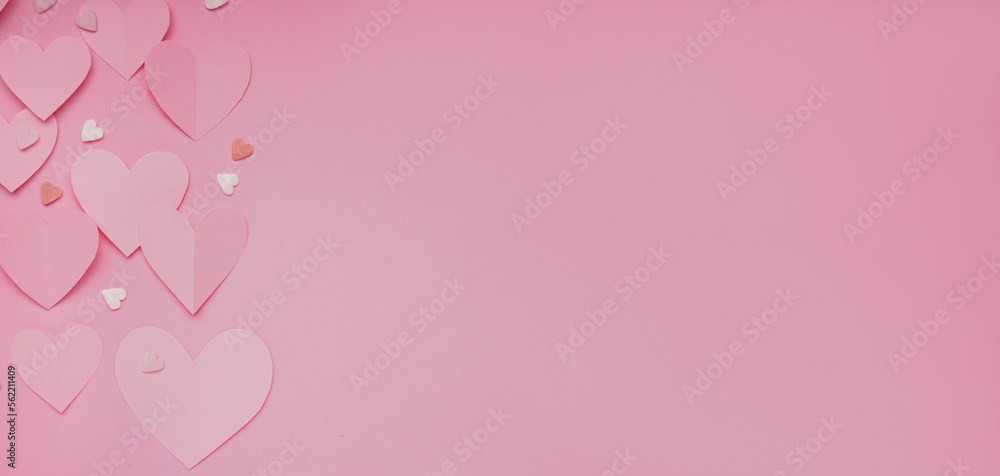 Paper hearts and sprinkles on pink background with space for text. Valentines Day celebration Paper hearts and sprinkles on pink background with space for text. Valentines Day celebration