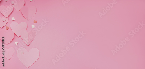 Paper hearts and sprinkles on pink background with space for text. Valentines Day celebration © Pixel-Shot