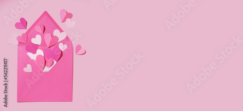 Envelope with paper hearts on pink background with space for text. Valentines Day celebration © Pixel-Shot