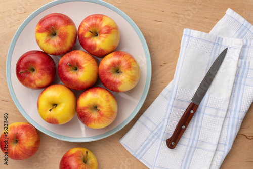 Photography ripe apples close-up in a bowl on a wooden background