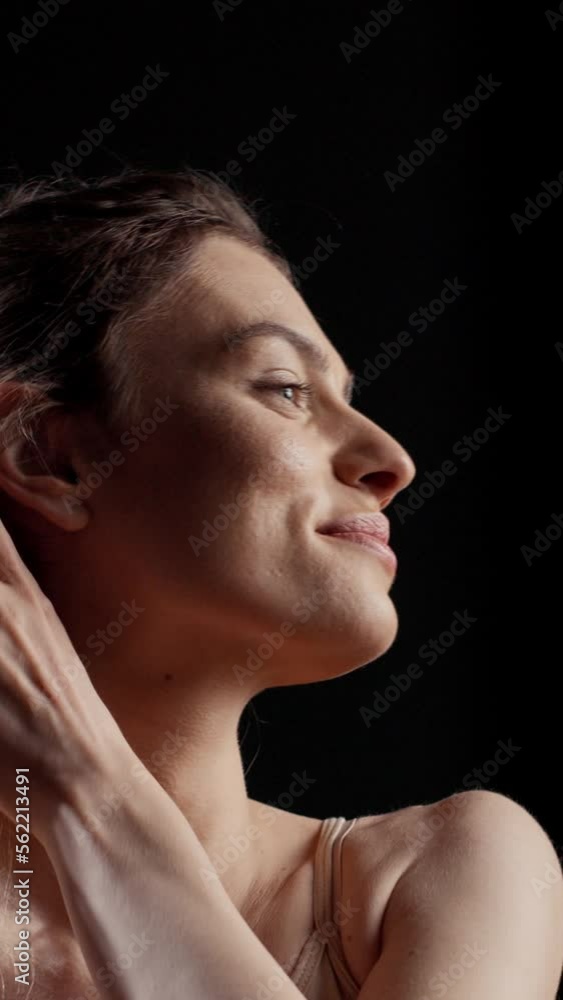 Vertical video: Sensual beauty model creating skincare campaign in studio and promoting natural products for bodycare and self love. Glowing radiant woman with luminous skin posing with confidence. Vertical video: Sensual beauty model creating skincare campaign in studio and promoting natural products for bodycare and self love. Glowing radiant woman with luminous skin posing with confidence.
