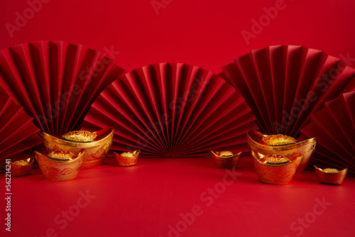 Fototapete Chinese New Year product display background with ingot and paper fan