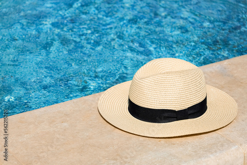Summer hat on edge of swimm...