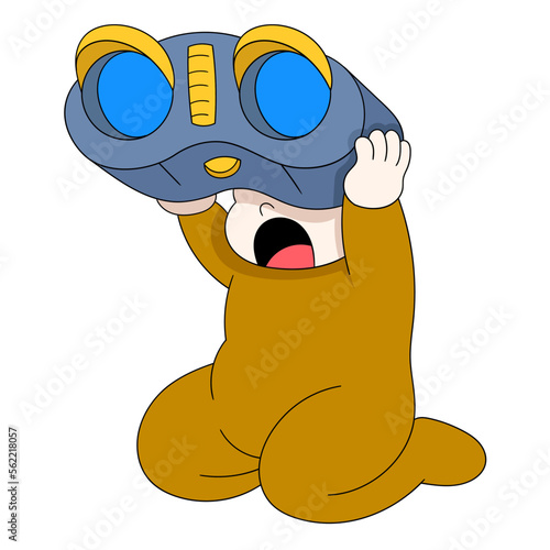 baby boy is playing using binoculars to peek