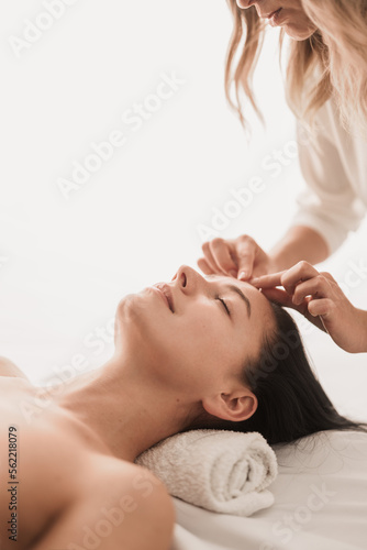 Crop masseuse doing massage to client