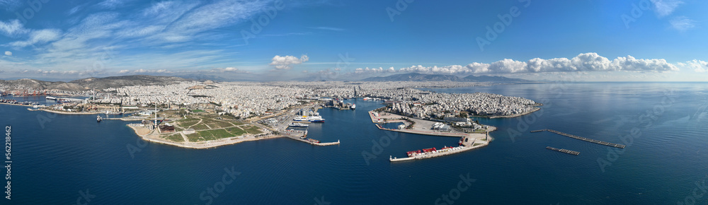 Aerial drone ultra wide panoramic photo from busy port of Piraeus where passenger ships travel to Aegean destination islands, Attica, Greece