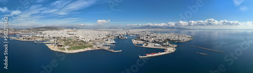 Aerial drone ultra wide panoramic photo from busy port of Piraeus where passenger ships travel to Aegean destination islands, Attica, Greece