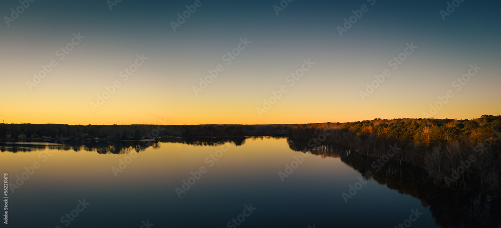 Fototapeta premium Beautiful aerial view of a lake at sunset, nature. ozark lakes, peachtree city.