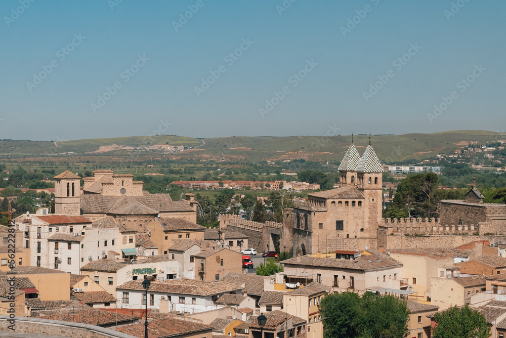 Segovia, España. April 29, 2022: Walls of Toledo and alpha tower with urban landscape.