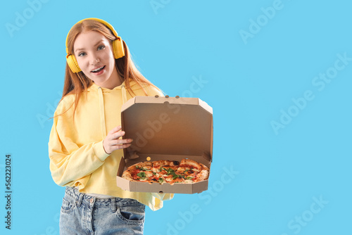 Young woman in headphones w...