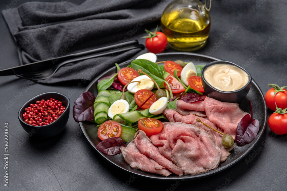 Roast beef with spinach salad and quail eggs healthy lunch keto diet food Roast beef with spinach salad and quail eggs healthy lunch keto diet food