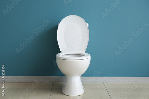 Ceramic toilet bowl near bl...