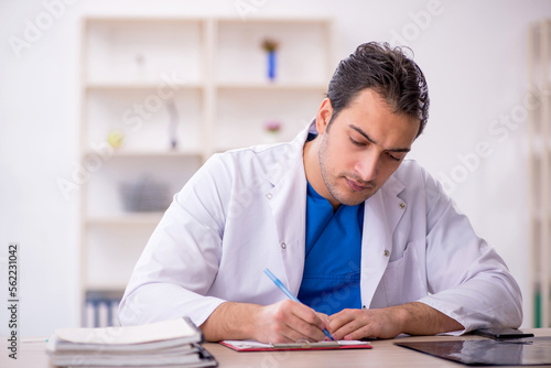 Young male doctor working in the clinic © Elnur