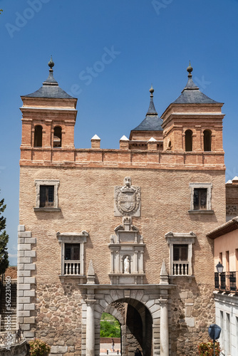 Toledo, España. April 29, 2022: Domes and facade of city churches with blue sky.