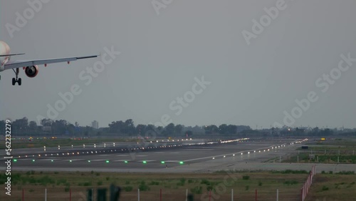 Slow motion of the passenger airplane touching down the runway in Barcelona
