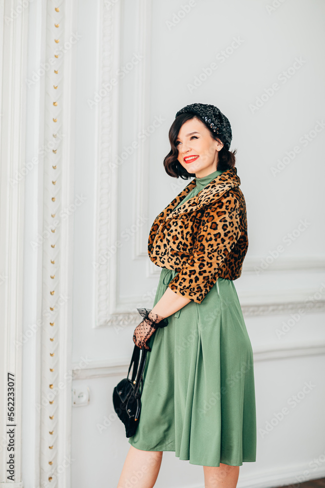 beautiful and playful brunette in retro clothes, gloves, beret and with handbag. beautiful and playful brunette in retro clothes, gloves, beret and with handbag.