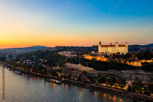 View of Bratislava castle, old town and the Danube river from observation deck the bridge in Bratislava, Slovakia at night © olyasolodenko