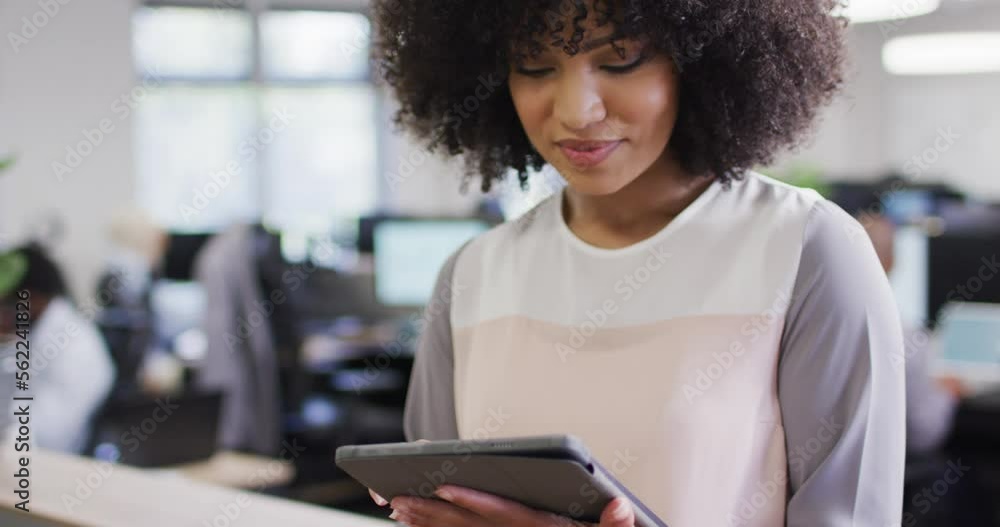 Portrait of happy african american businesswoman working with colleagues in office, slow motion Portrait of happy african american businesswoman working with colleagues in office, slow motion