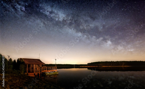 Milky way over a fisherman s hut at the lake