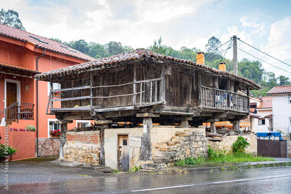 View of an Asturian granary called Horreo, in the village of Mere in a rainy day