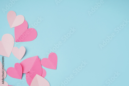 Beautiful paper hearts on blue background. Valentines Day celebration © Pixel-Shot