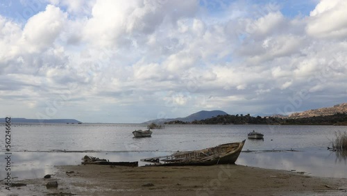 Fishing boats moored along the shore of Lake Bafa in Turkey.	
 photo