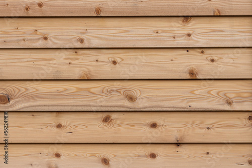 A texture of brown boards with knots and resin painted with impregnation for wood