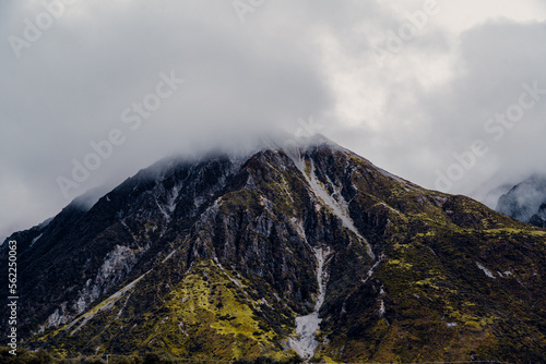 Fototapeta Naklejka Na Ścianę i Meble -  Aerial Drone View of Massive Mountain, Misty On Top in New Zealand
