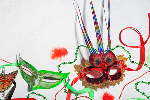 Carnival masks with beads on white background