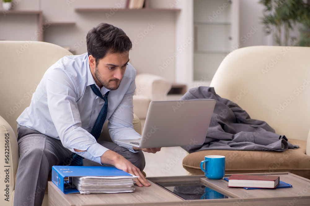 Young male employee working from home Young male employee working from home