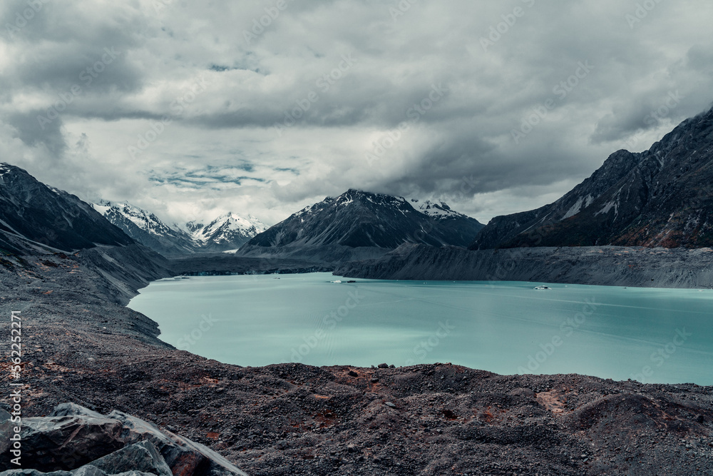 Melted Glacial Lake Surrounded By Snow Covered Mountains in Mount Cook National Park, New Zealand