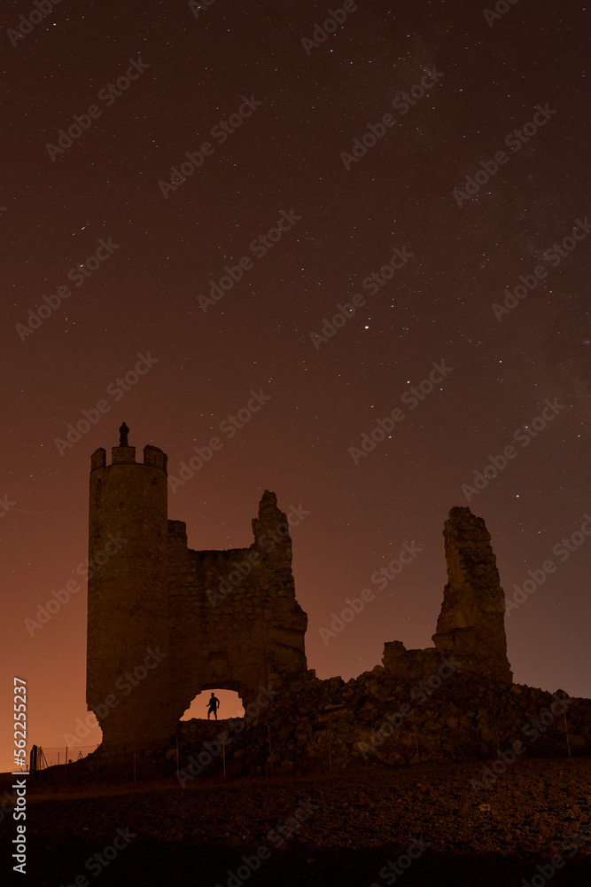 Caudilla castle in ruins at night with the Milky Way. Spain