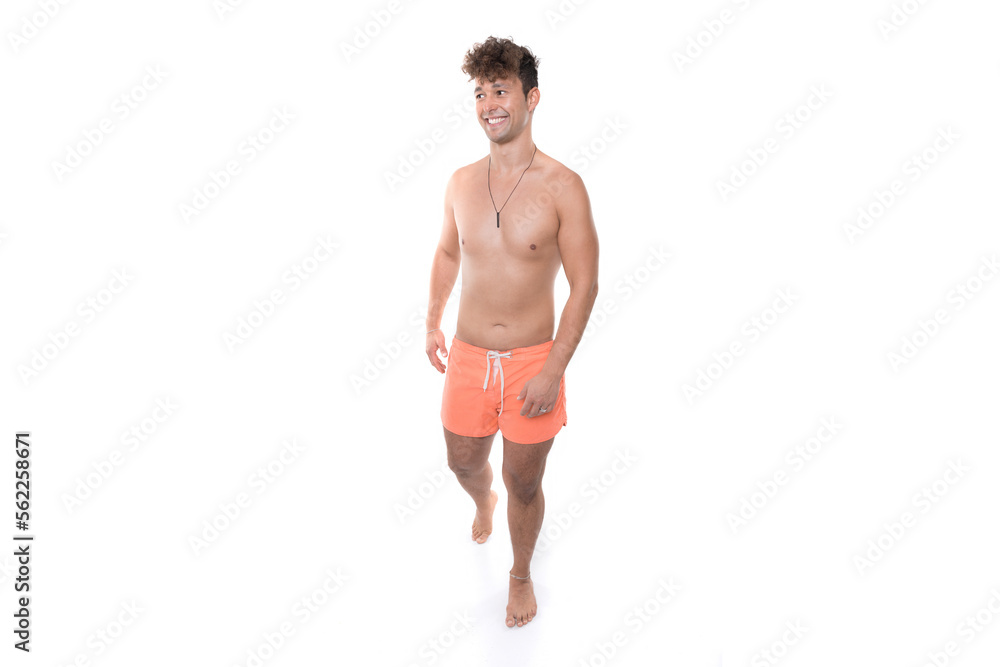 mockup of man apparel with orange swim trunk walk and look to side chunky without sixpack