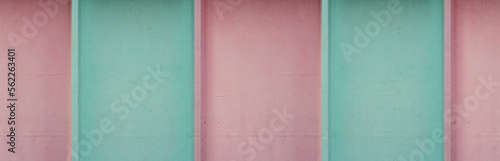 Seamless horizontal banner. Striped pattern of blue, turquoise and pink stripes. Fragment of concrete wall in pastel color. Muted soft tones. Background. Wide line. Bold minimalism. Copyspace. Retro © brajianni