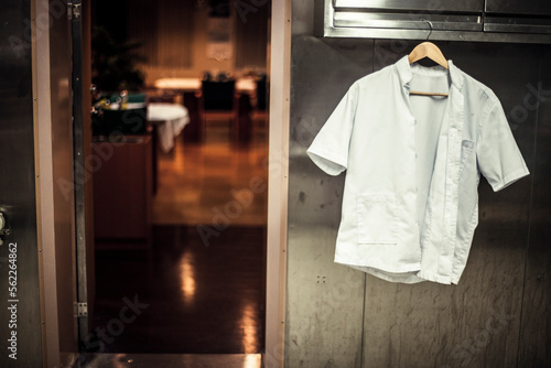 Kitchen staff's shirt hanging to dry on board a container ship. photo