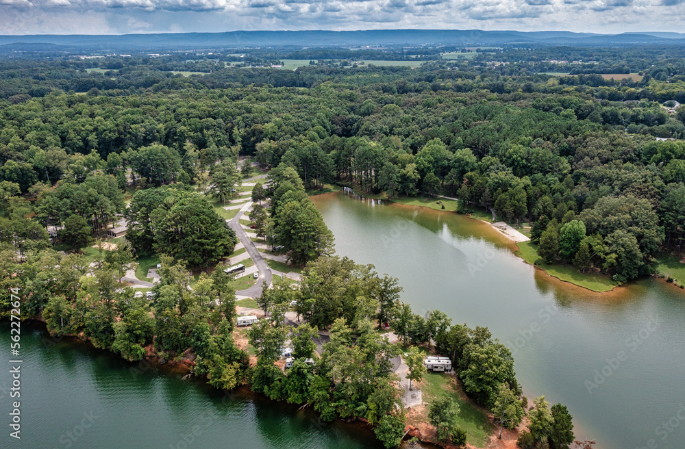 Aerial view of beautiful Tims Ford Park RV campground on the lake with the mountain and Winchester Tennessee in the background.