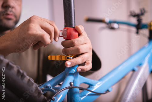 Man hands installing a bike light