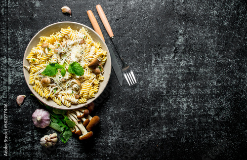 Fusilli pasta with mushrooms, garlic and mint leaves.